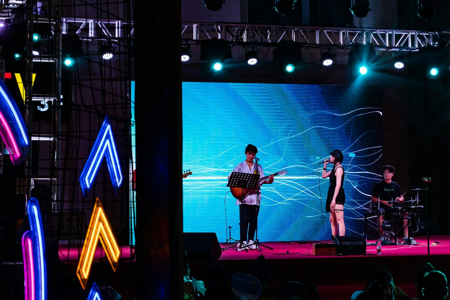 Band performing in front of a large LED wall